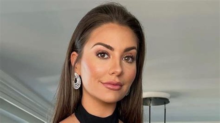 Kelley Flanagan Shares Swimsuit Photo Saying "Visit Greece" —